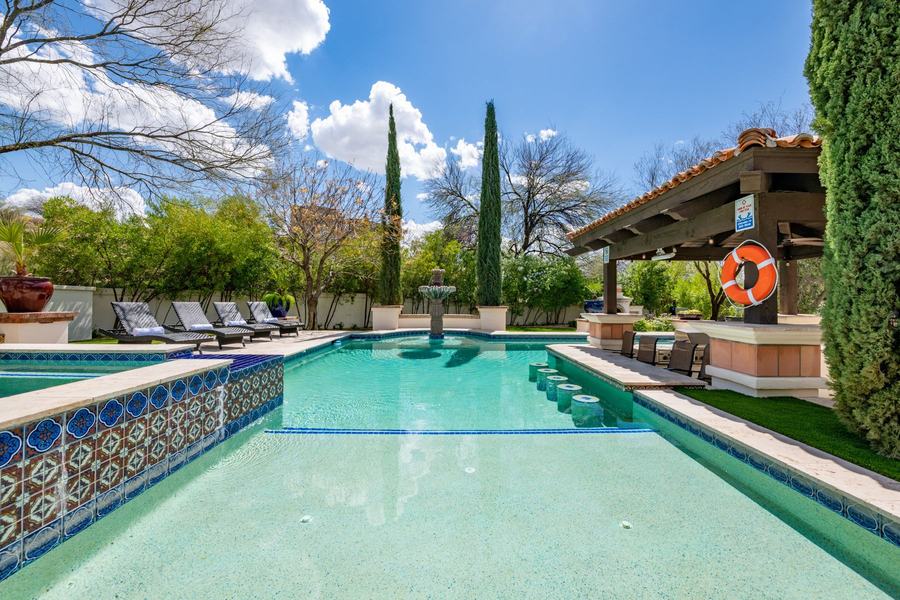 Massive Heated Pool with Swim-Up Bar, Fountains & Lounge Seating